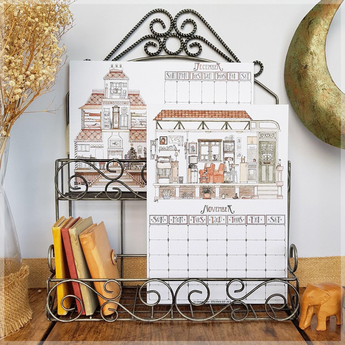 Erlenmeyer cat calendar showing the months of December and November , displayed on a wire frame display rack.