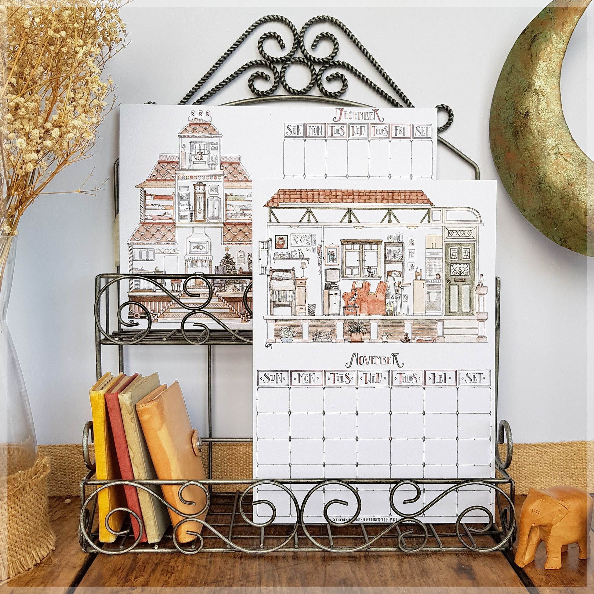 Erlenmeyer cat calendar showing the months of December and November , displayed on a wire frame display rack.