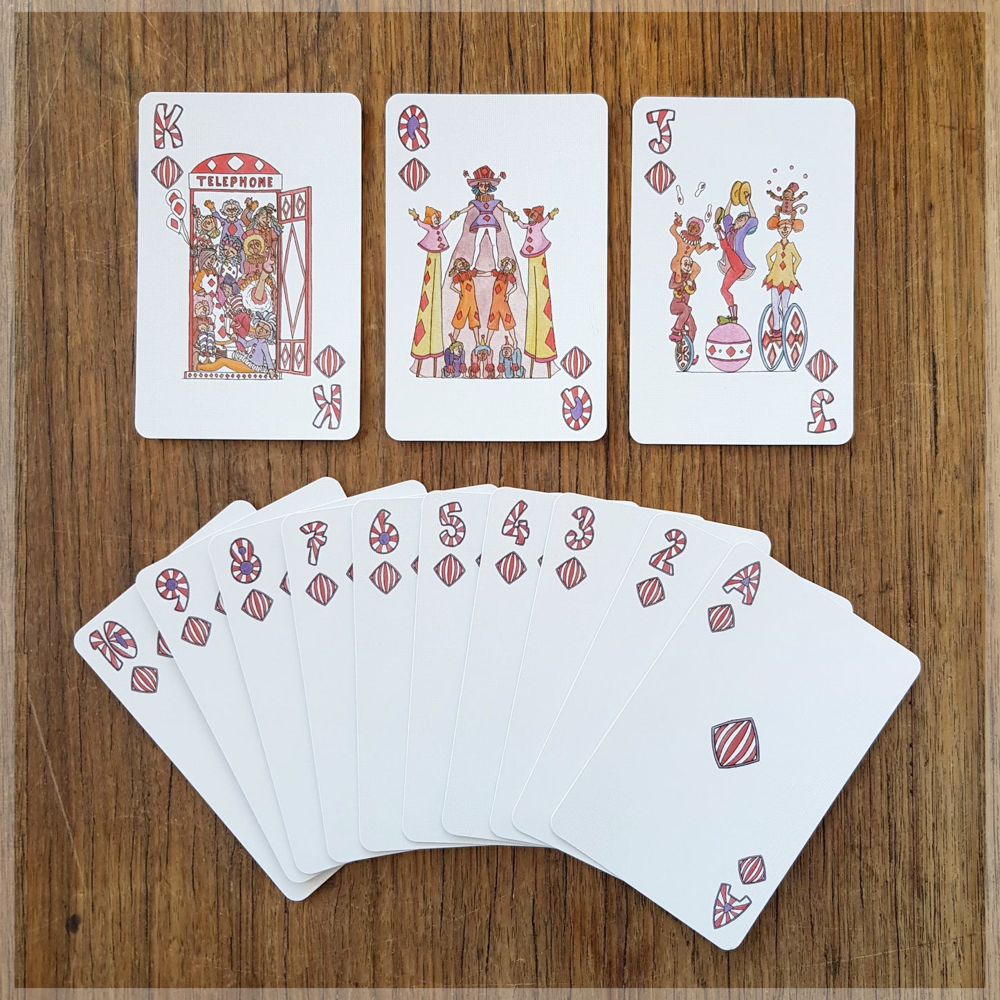 Hand Illustrated Circus playing cards showing the suit of diamonds. This suit shows off the circus clowns