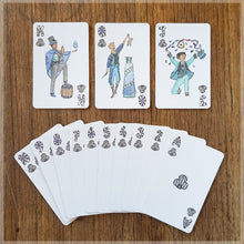 Hand Illustrated Circus playing cards showing the suit of clubs. This suit shows off the circus magicians