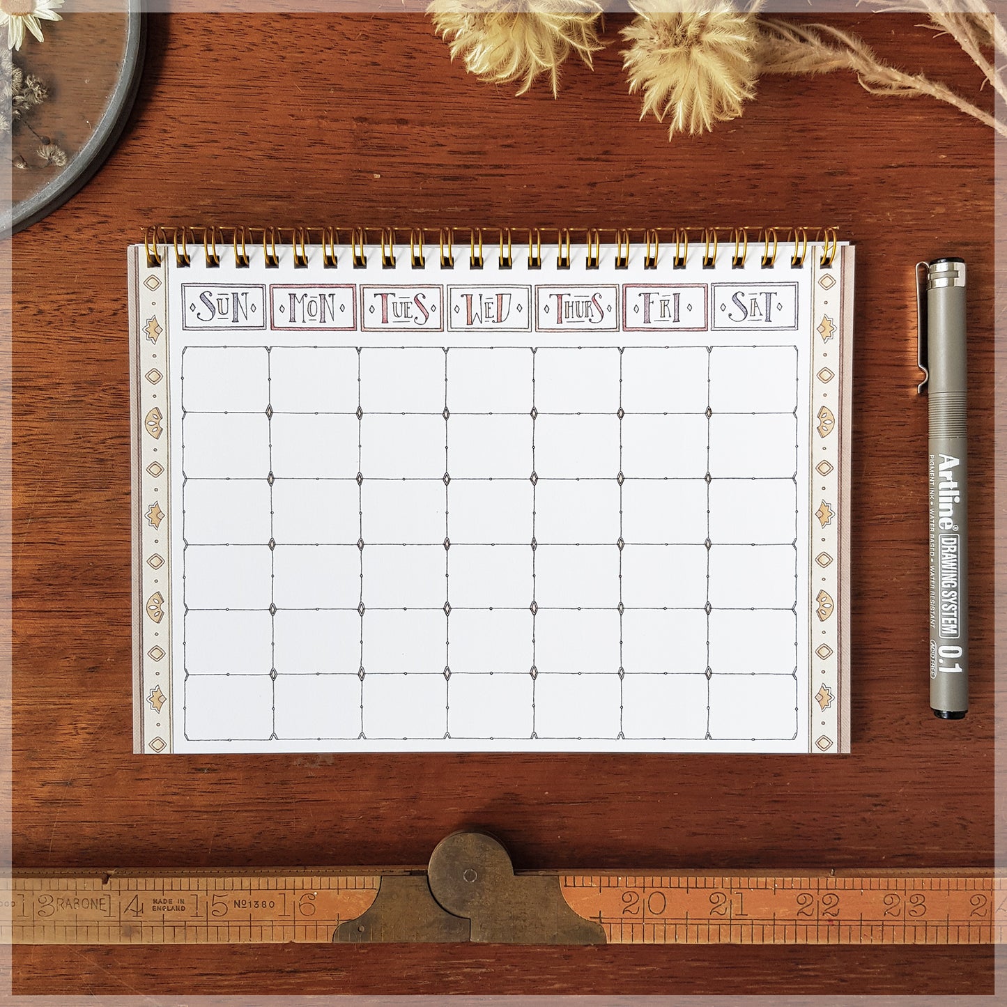 Flat lay photograph of our Erlenmeyer note book. showing the weekly planner on the back page.