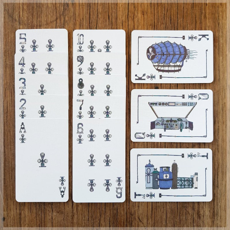 Hand Illustrated Steampunk playing cards showing the suit of clubs. The picture cards show the engine room, cockpit and the full ship.