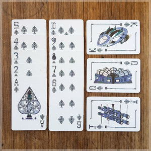Hand Illustrated Steampunk playing cards showing the suit of spades. The picture cards show the engine room, weapons room and the full ship.