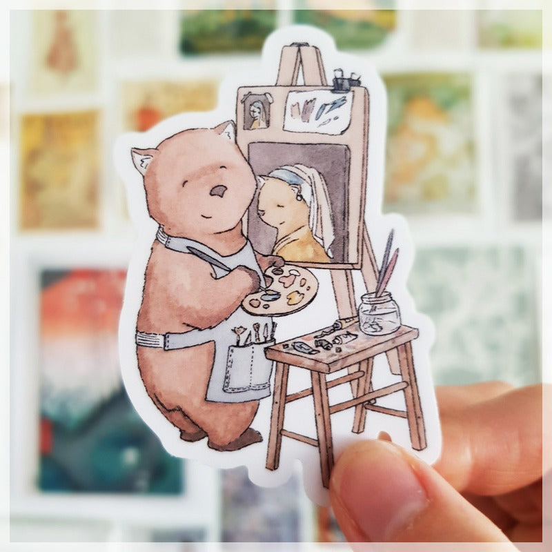 A gentle and serene wombat paints 'Girl with the pearl earring' as a tribute to one of her favorite artists.